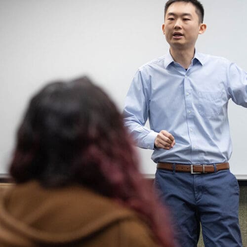 A PNW professor speaks in a classroom