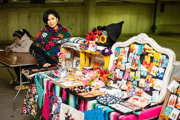 A vendor displays their products during the Hispanic Heritage Month festival