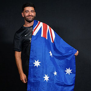 Jacob Battista holding an Australian flag