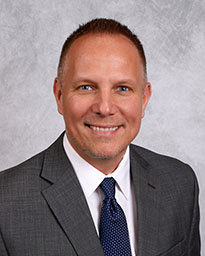 Head shot of Rick Calinski in suit and tie