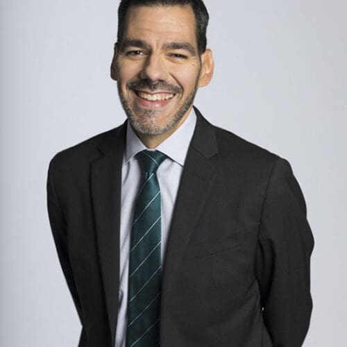 Jose Sanchez in a suit and tie