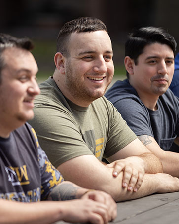 Student veterans sit outside together