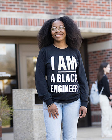A student wears a long sleeve shirt that reads "I am a Black engineer"