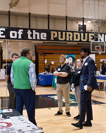 Students talk with employers during a career expo