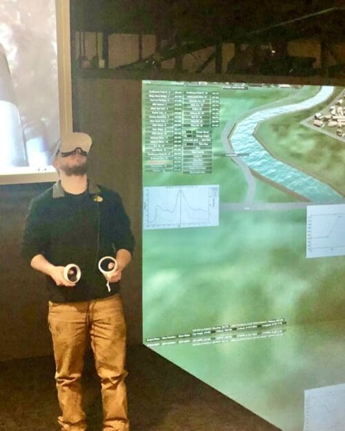 student demonstrates virtual reality headset