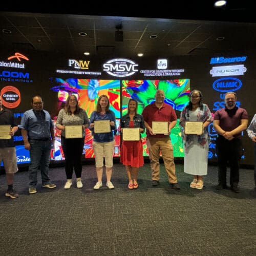 group of teachers holding certificates