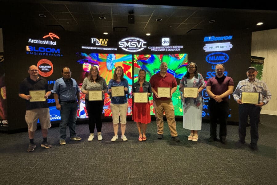 group of teachers holding certificates