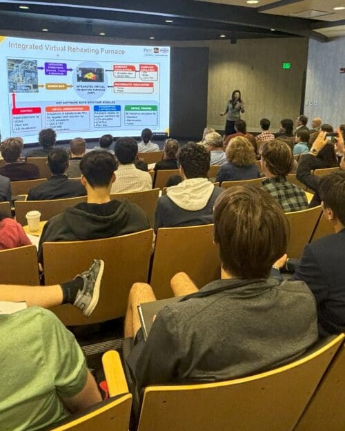 woman presenting slide to audience