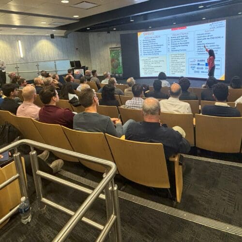 group of people listening to a presentation