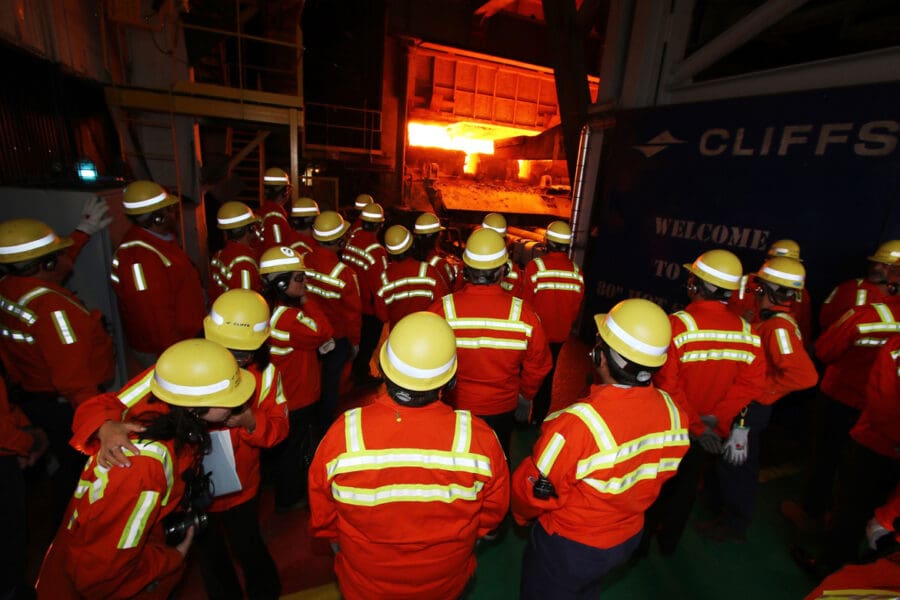 group of people at a furnace