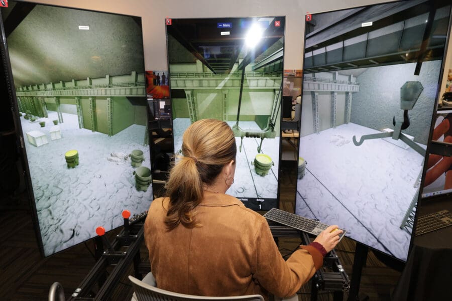 woman operating a crane simulator