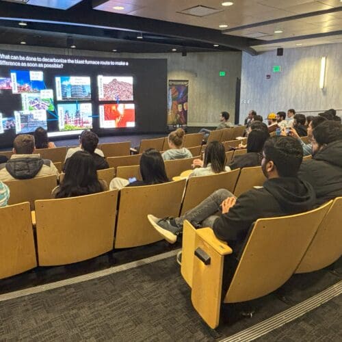 group of people watching a lecture