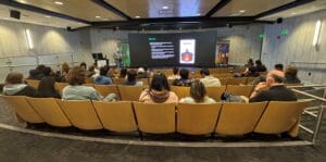 man presenting to an audience