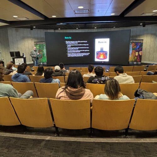 man presenting to an audience