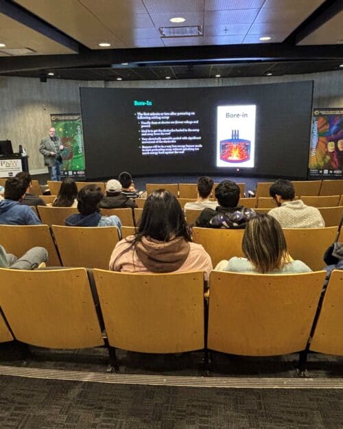 man presenting to an audience