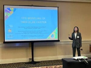 woman presenting at a conference