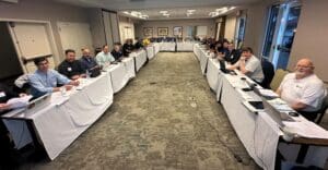 group photo of people sitting at a table