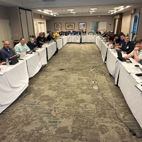 group photo of people sitting at a table