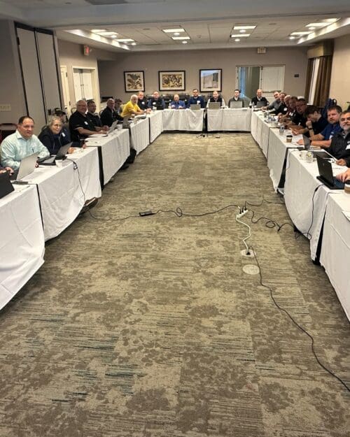 group photo of people sitting at a table