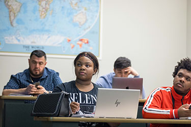 Business students sit in class