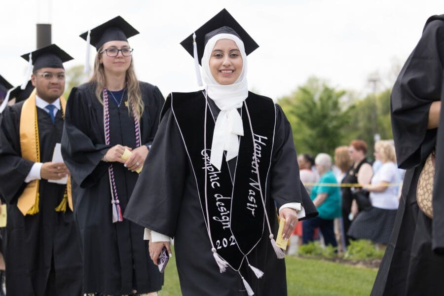 Students walking in during a commencement ceremony