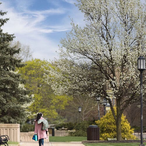 A student walks across PNW's Westville campus