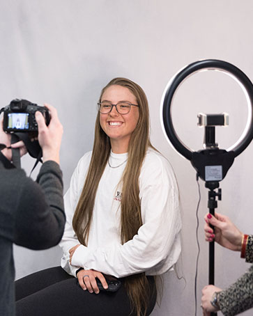 A student gets a professional headshot taken