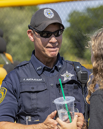 PNW Policeman stands outdoors