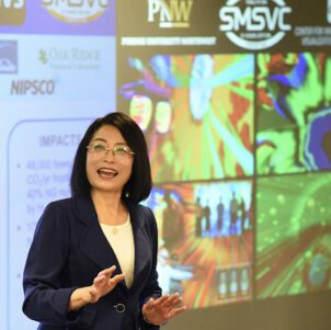 PNW Professor Chenn Zhou addresses a conference