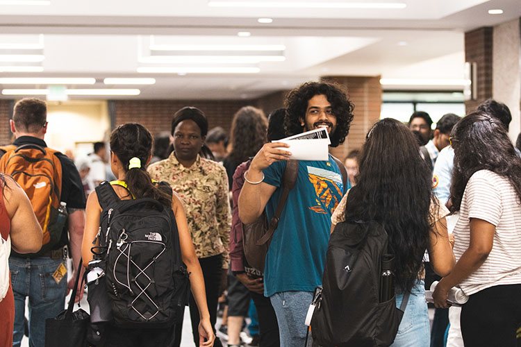 Students gather in a campus hallway