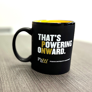 Coffee mug that reads "That's Powering Onward"