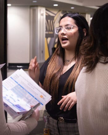 A student talks during a presentation