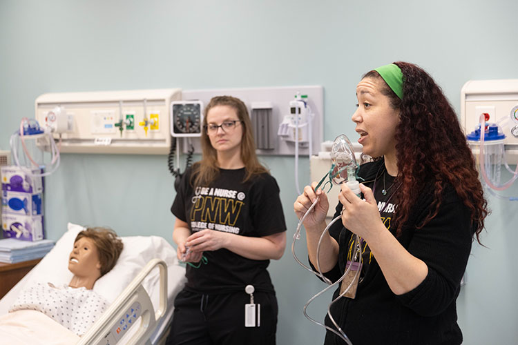 Nursing students participate in a lab