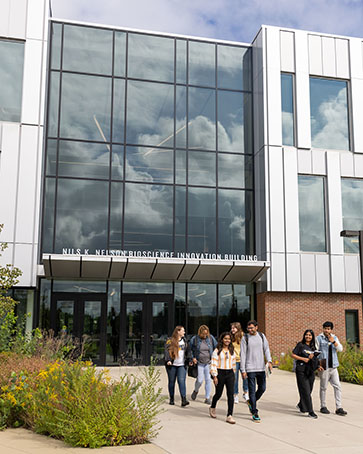 Students walk out of the Nils K. Nelson Bioscience Innovation Building