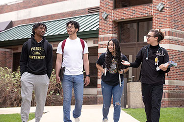 PNW students walk across campus