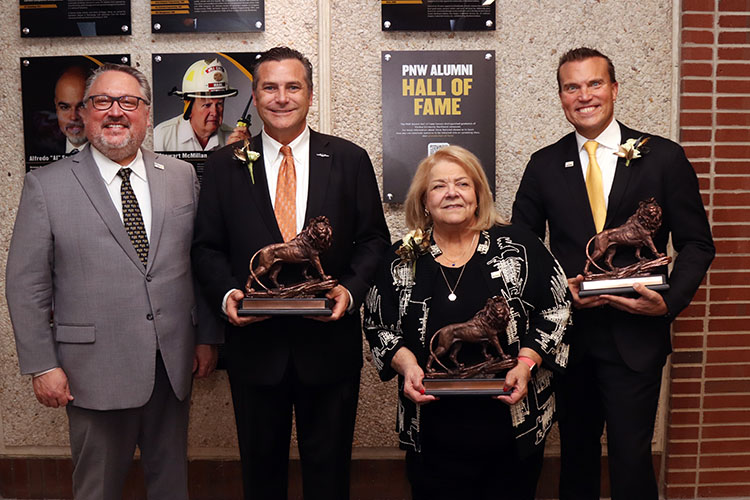 PNW Chancellor Chris Holford poses with the 2024 PNW Alumni Hall of Fame class: Mayor Thomas McDermott Jr., the Honorable Diane Kavadias Schneider and Jeff Strack, president and CEO of Indiana Grocery Group.