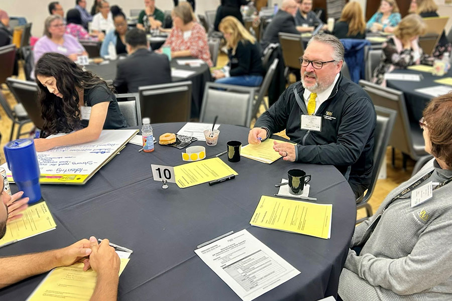 Chancellor Holford joins a strategic planning brainstorming session