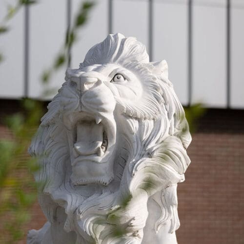 A white stone lion statue