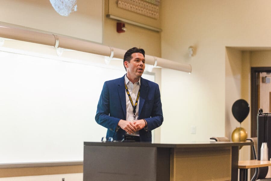 Faculty Fellow for Undergraduate Research introducing the keynote speaker.