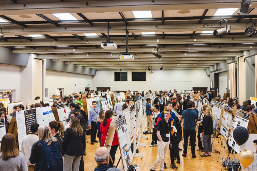 Students and faculty presenting research via poster presentations