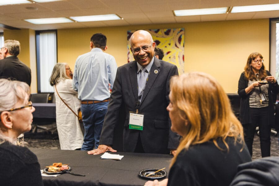 AVC Latif speaking with faculty during the faculty reception.