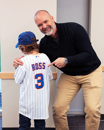 David Ross poses with a fan at the 2024 Sinai Forum.