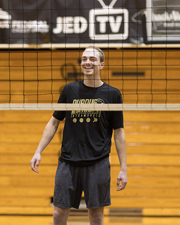 A student plays intramural volleyball.