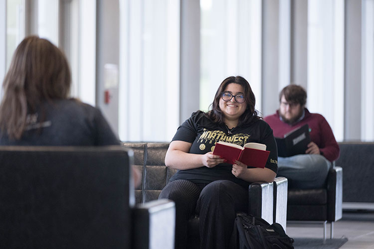 Students sit in chairs on the Westville campus