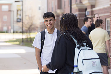 PNW students talk on campus.