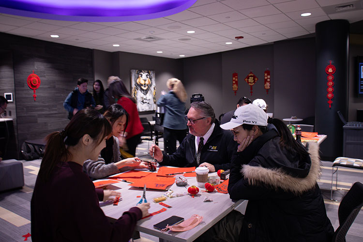 Chancellor Holford and students celebrate the Chinese New Year