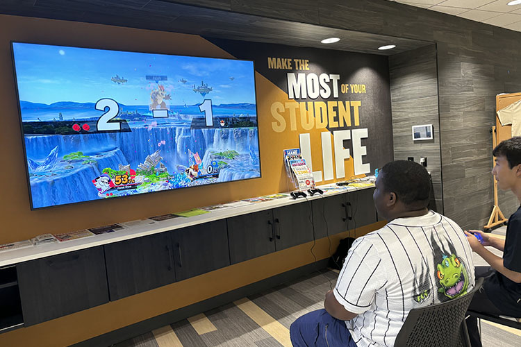 Students play Mario Kart in the PNW Mane Zone