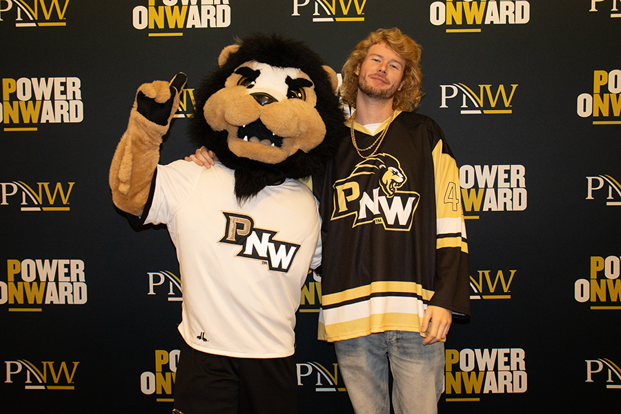 PNW's mascot, Leo the Lion, poses with Yung Gravy