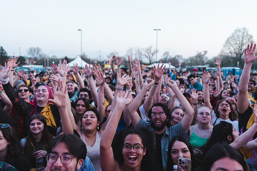 Roaring Loud crowd waving their hands in the air.