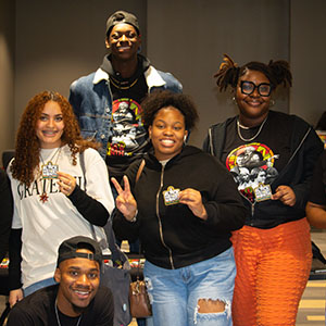 Five students stand together during a Black History Month celebration